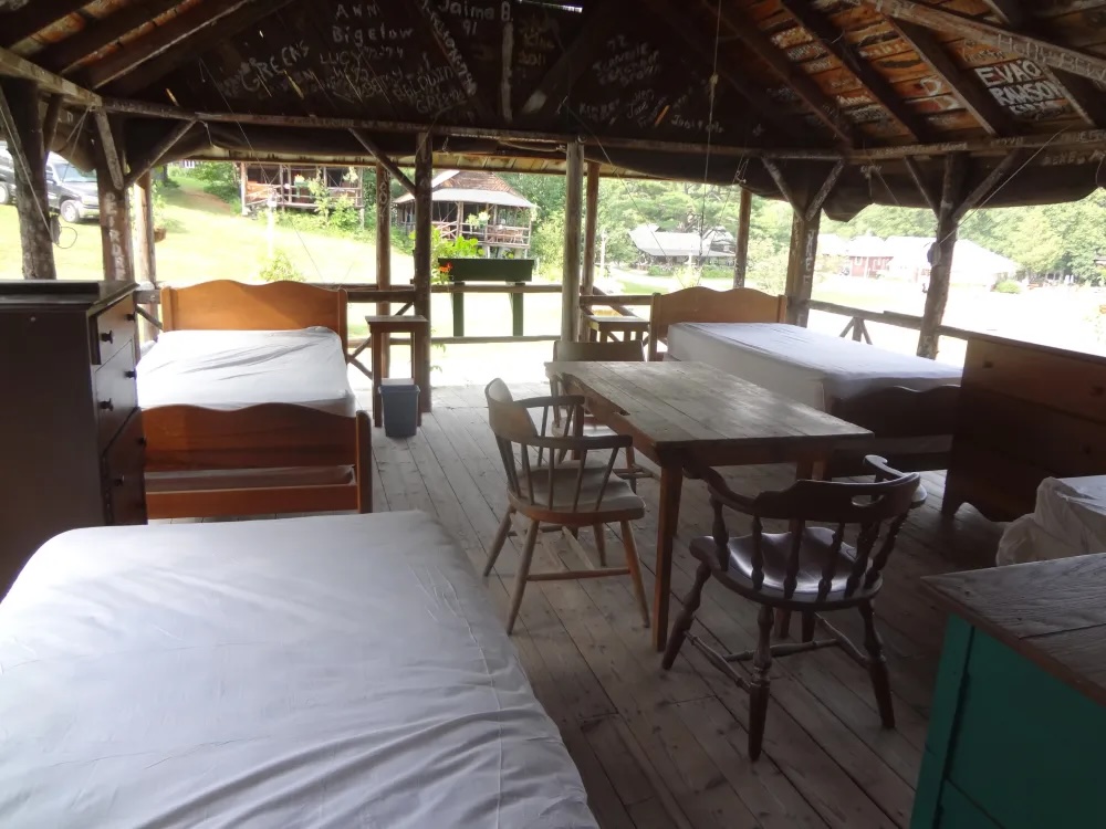 Inside an open-air Adirondack cabin