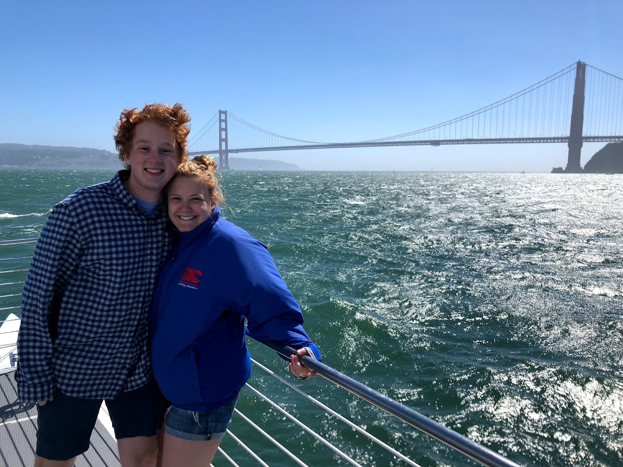 Anna and Alex on a sailboat near the Golden Gate Bridge, San Francisco