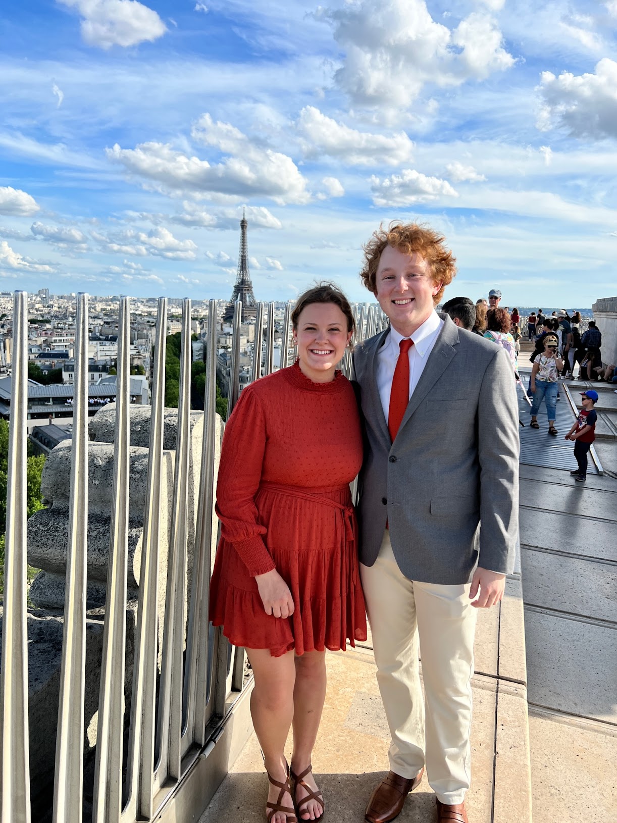 Anna and Alex dressed up in Paris with the Eiffel Tower behind them, 2022
