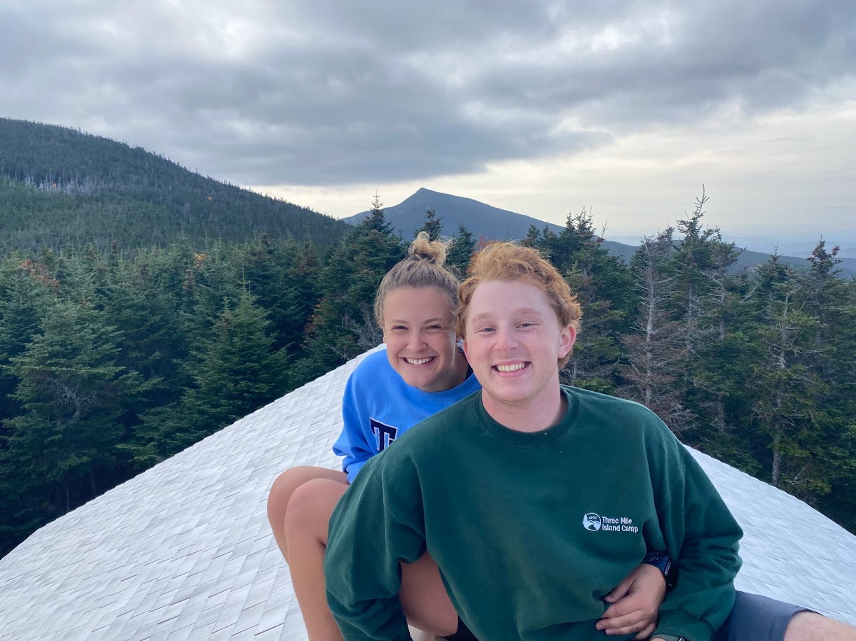Anna and Alex on the roof of Galehead Hut in the White Mountains