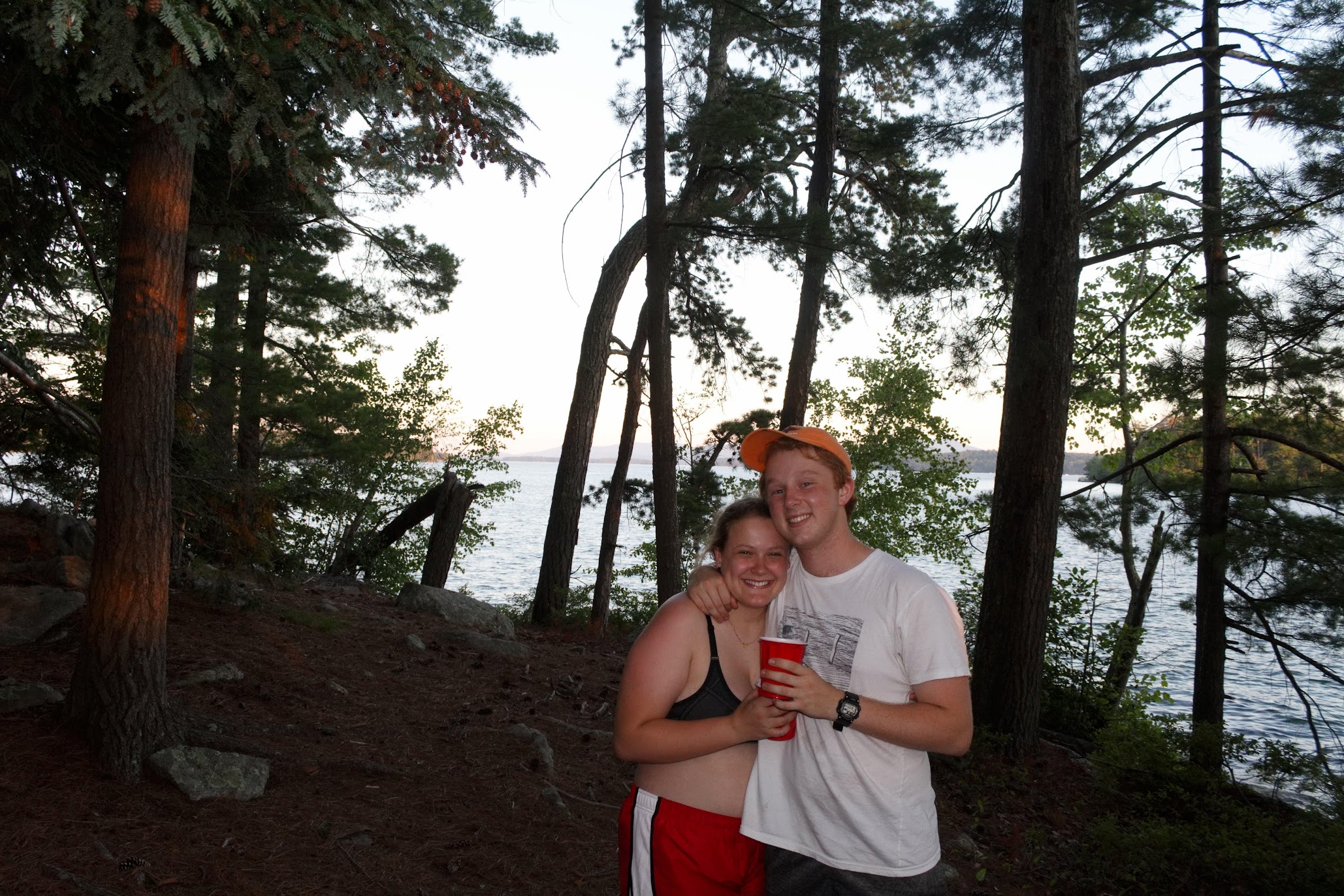 Anna and Alex in the woods at dusk during croo summer