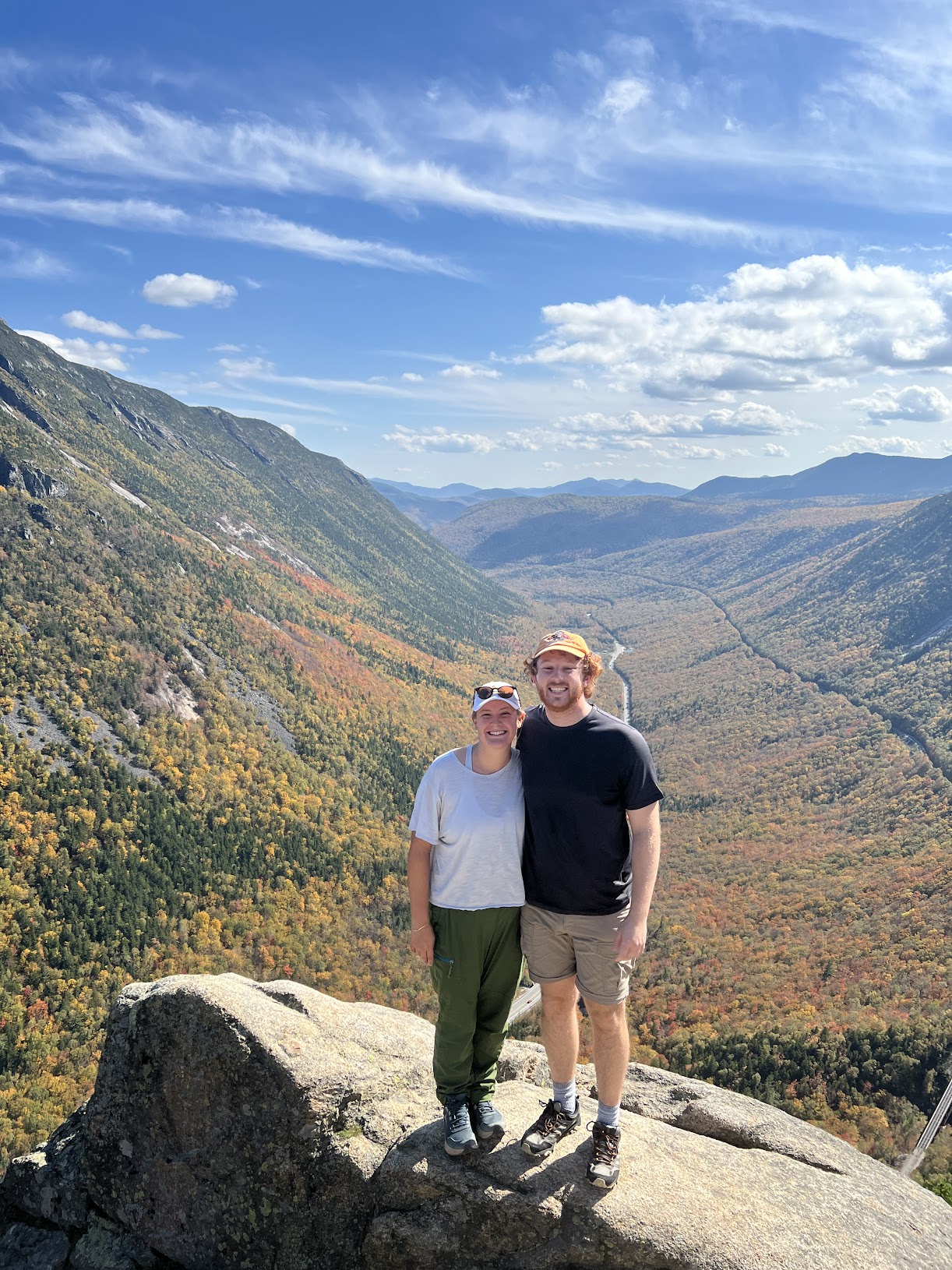 Anna and Alex overlooking fall foliage in the White Mountains, 2025